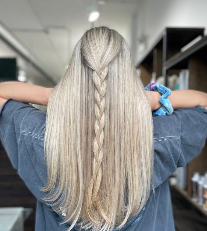 Creamy dimensional blonde with a delicate braid, color by Carla at Good Beauty Chicago